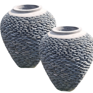 Two textured vases on a white background
