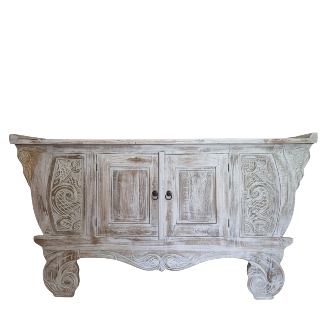 Hand-carved Balinese teak entryway cabinet whitewash finish, ornate carved legs and floral scrollwork on white background

