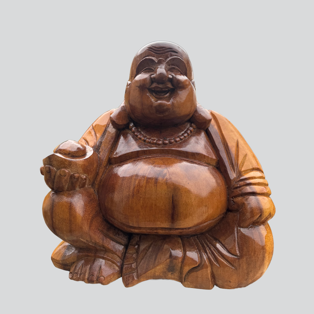 Wooden Buddha figurine on a light gray background