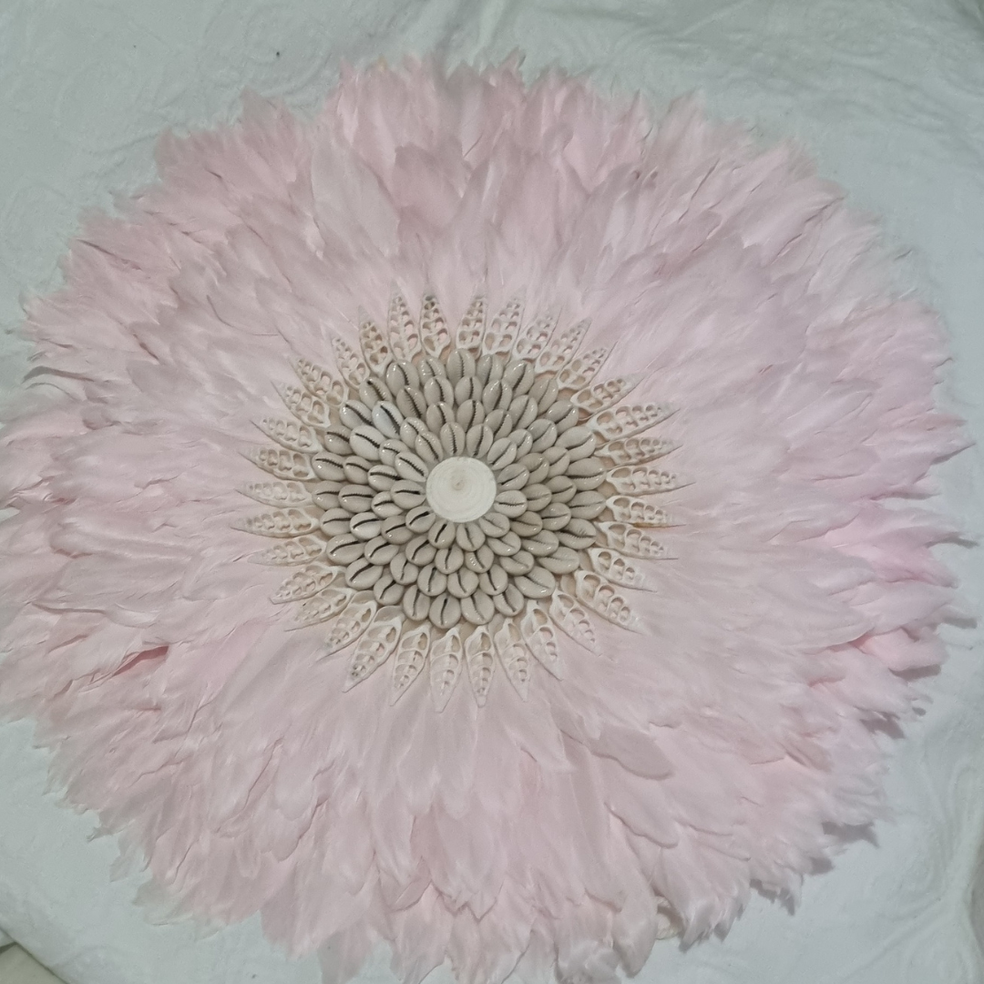 Close-up of a pink flower with a detailed center on a light background