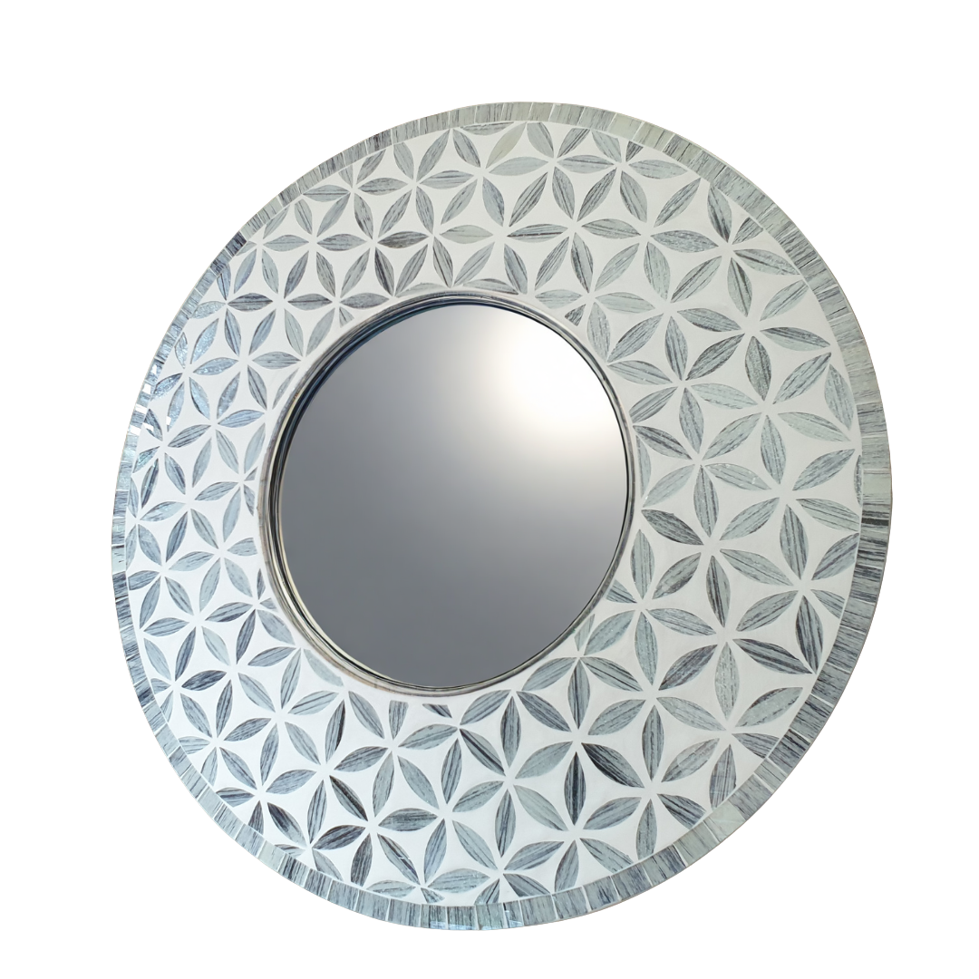 Round mirror with a decorative geometric pattern on a white background