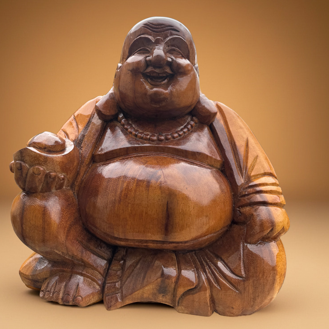Wooden statue of a laughing Buddha on a beige background