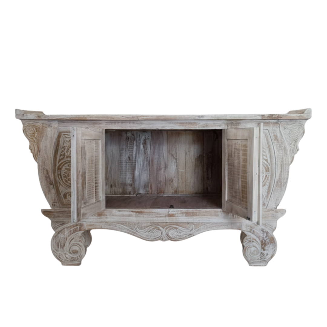 Hand-carved Balinese teak cabinet open doors revealing hidden storage, whitewash reclaimed timber finish on white background