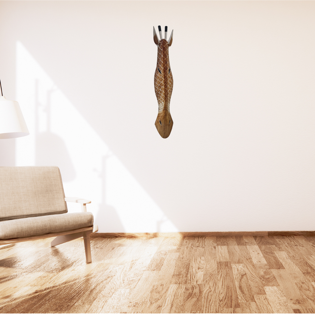 Handcrafted Wooden Giraffe & Zebra Masks Handcrafted Wooden Giraffe & Zebra Masks Handcrafted Wooden Giraffe & Zebra Masks Giraffe-shaped wall decal on a white wall with a beige sofa in the foreground.