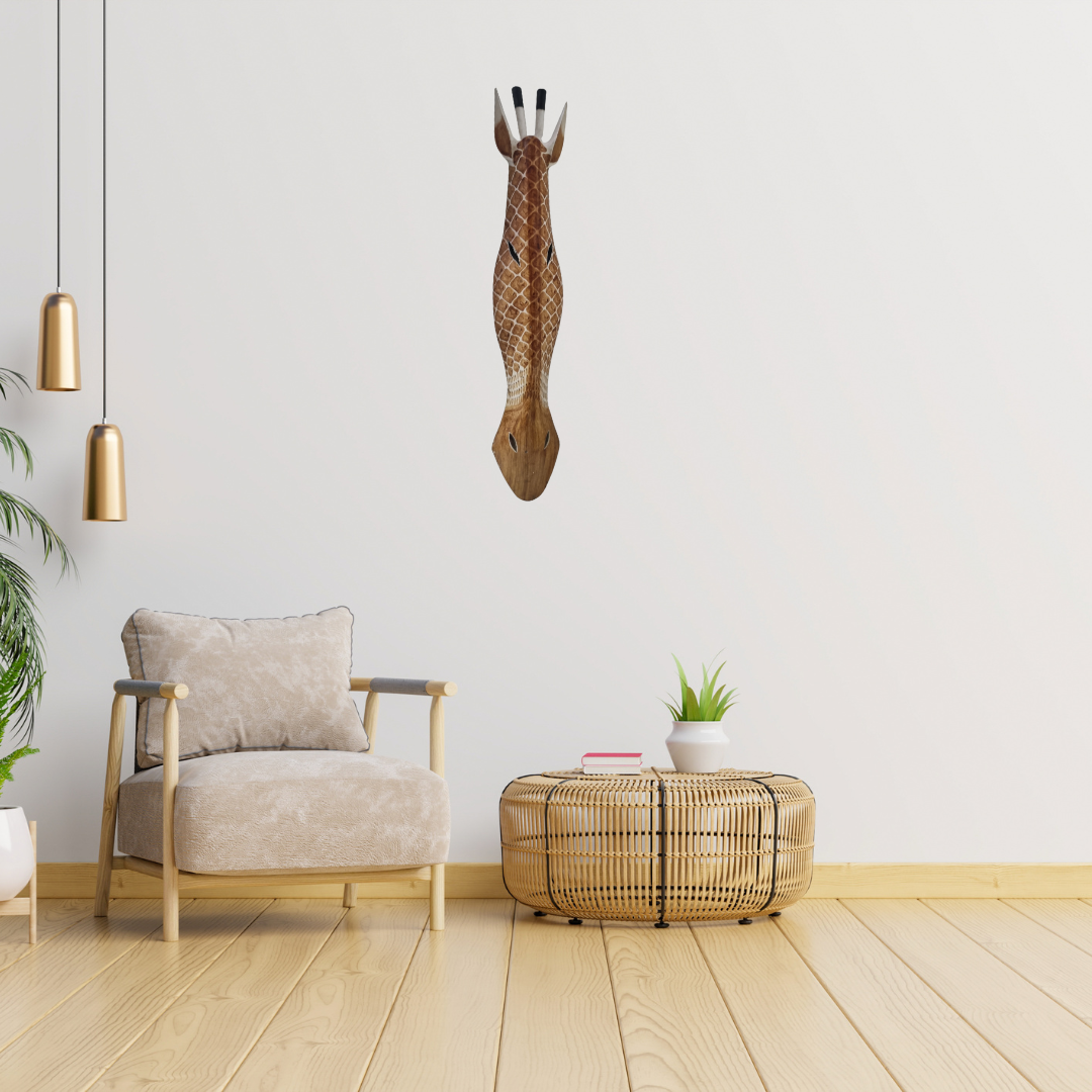 Handcrafted Wooden Giraffe & Zebra Masks Modern living room with a beige armchair, woven coffee table, and decorative giraffe head on the wall.