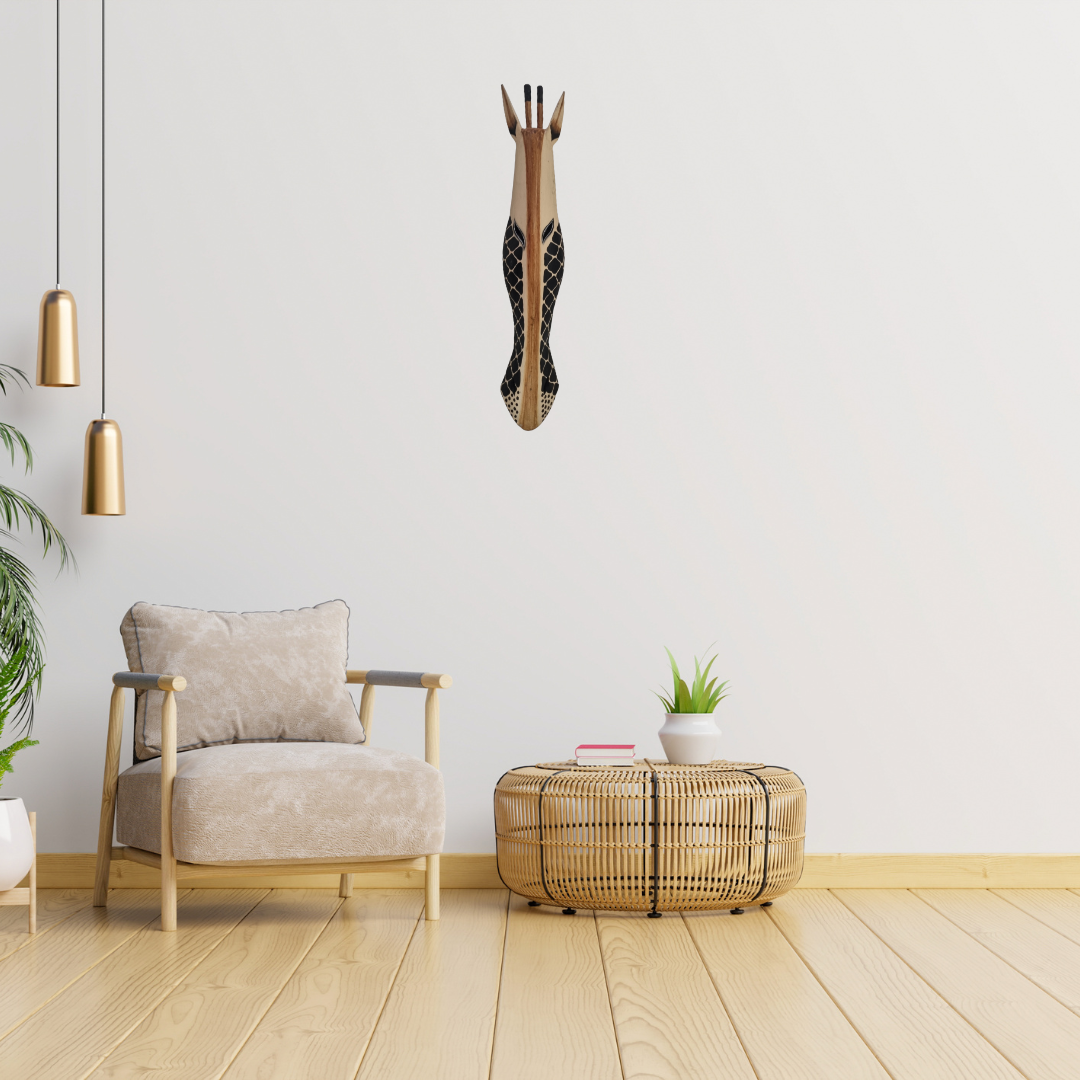 Handcrafted Wooden Giraffe & Zebra Masks Modern living room with a beige armchair, woven coffee table, and decorative giraffe wall art.