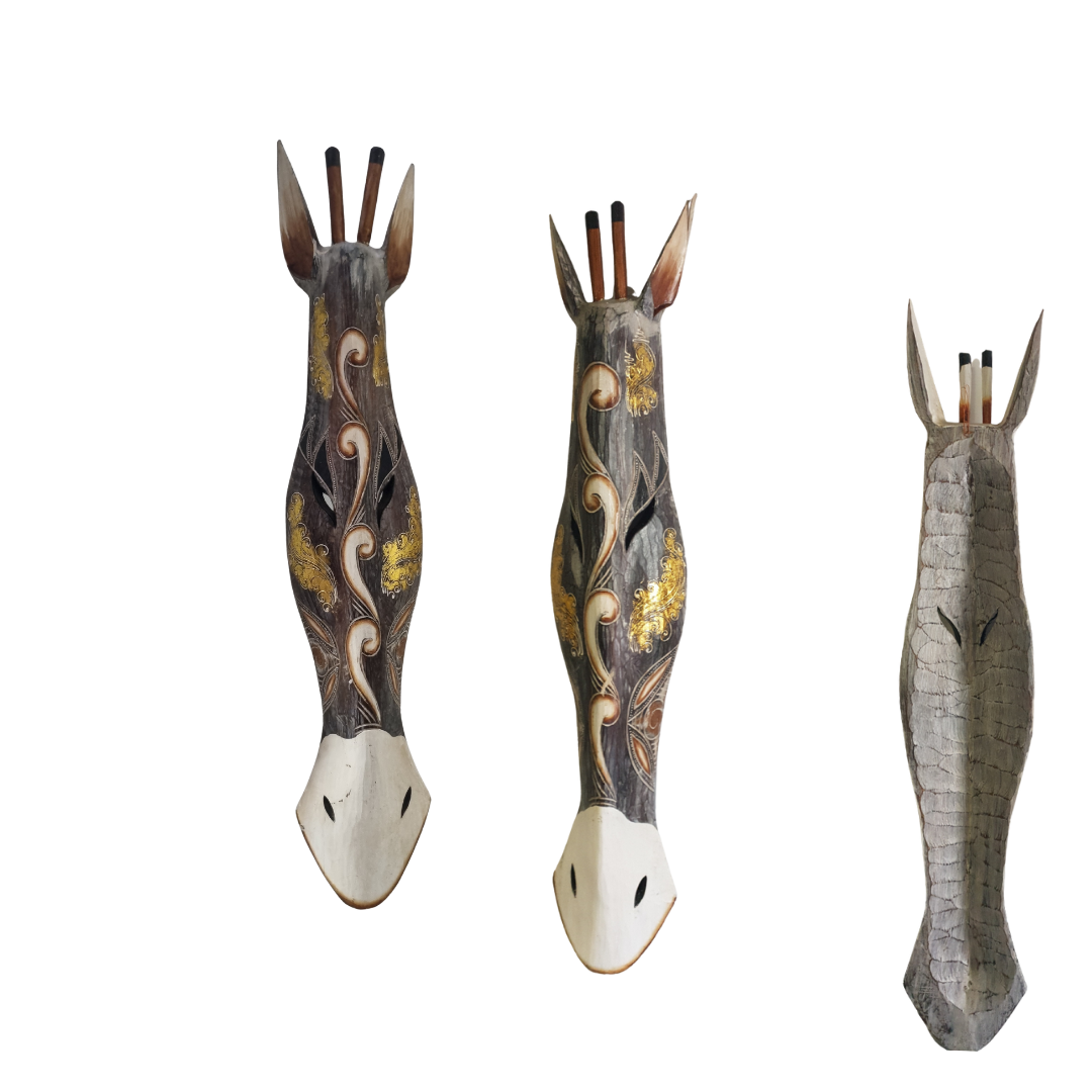 Three decorative animal head sculptures on a white background