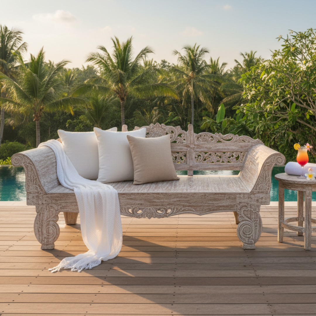 handcrafted teak day bed whitewashed teak day bed with linen cushions and muslin throw styled on a timber deck beside a turquoise infinity pool with tropical palms at golden hour – handcrafted outdoor furniture by Azure Decor