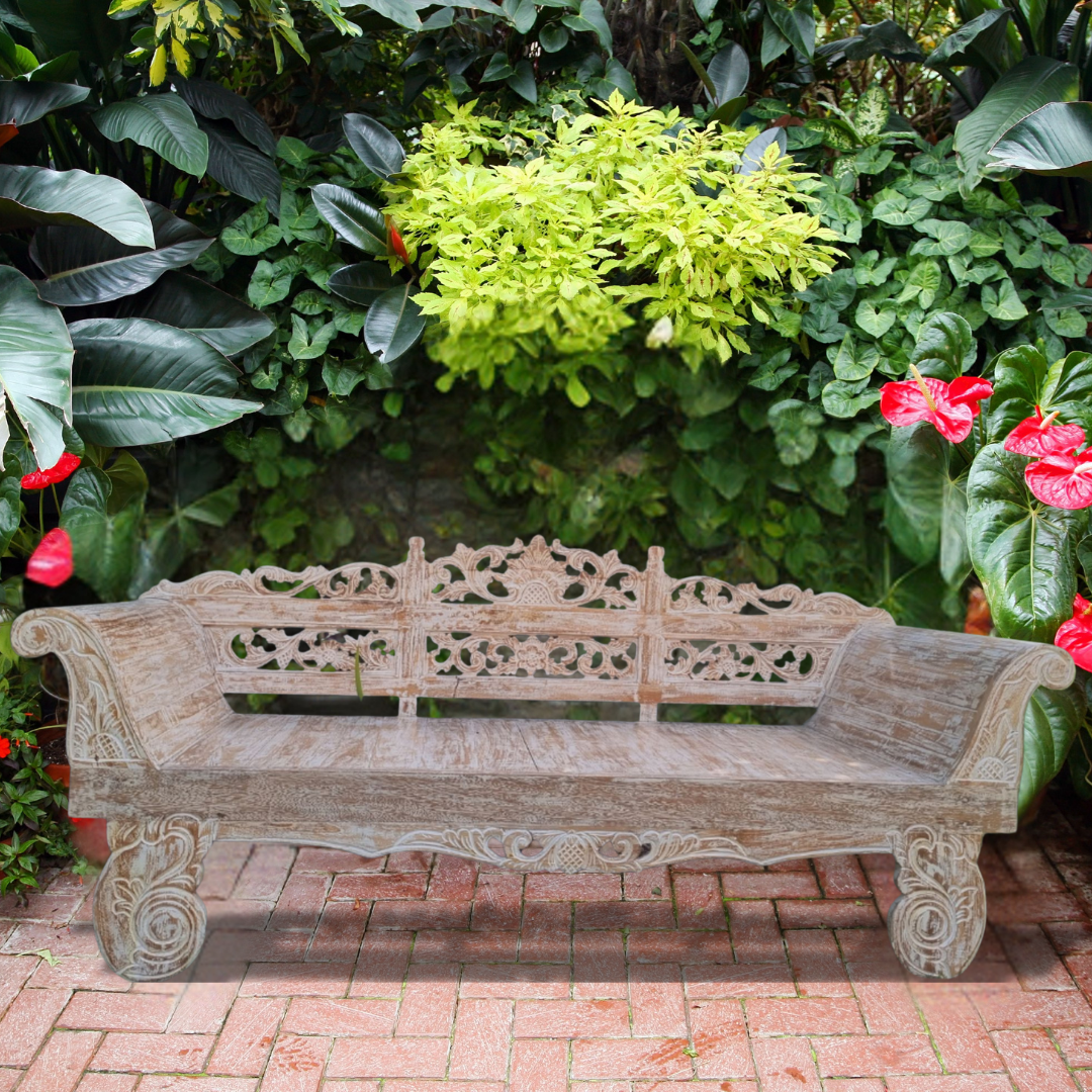 Wooden console table with decorative items against a white wall