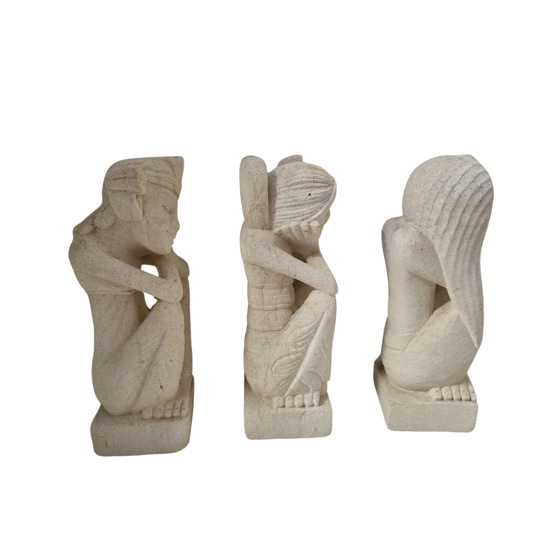 Two hand-carved limestone statues of a resting in tranquility couple in a resting pose, posed with hands resting on knees.