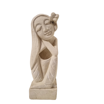 Seated female figure in a relaxed pose, with her hands resting on her knees.