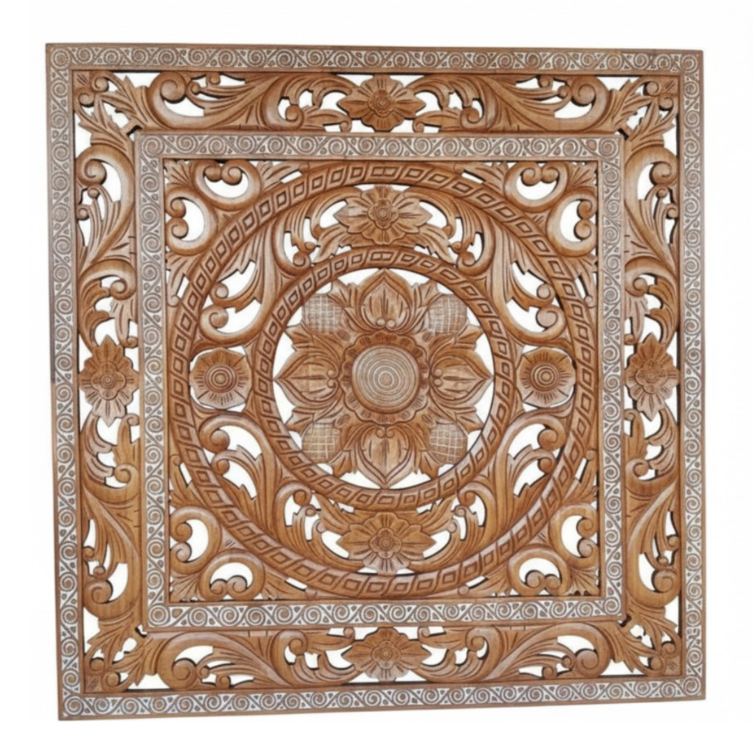 Decorative wooden panel with intricate carvings on a white background