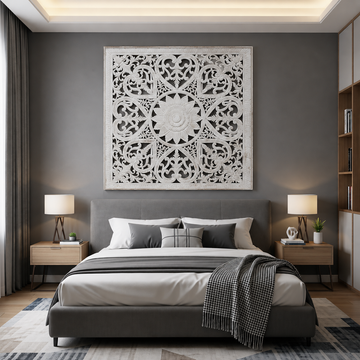 panel in white mounted high on a grey feature wall behind a king bed with grey upholstered base and layered cushions in a modern bedroom