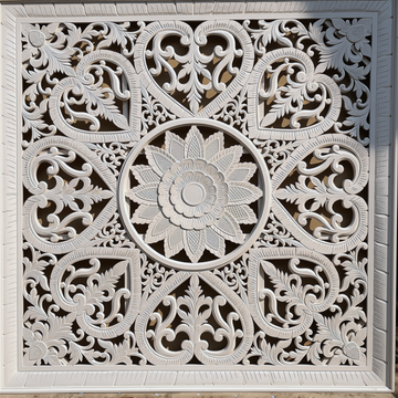 Close-up detail of white cut MDF Balinese wall panel showing central lotus flower mandala, heart motifs and scrolling acanthus leaf pattern