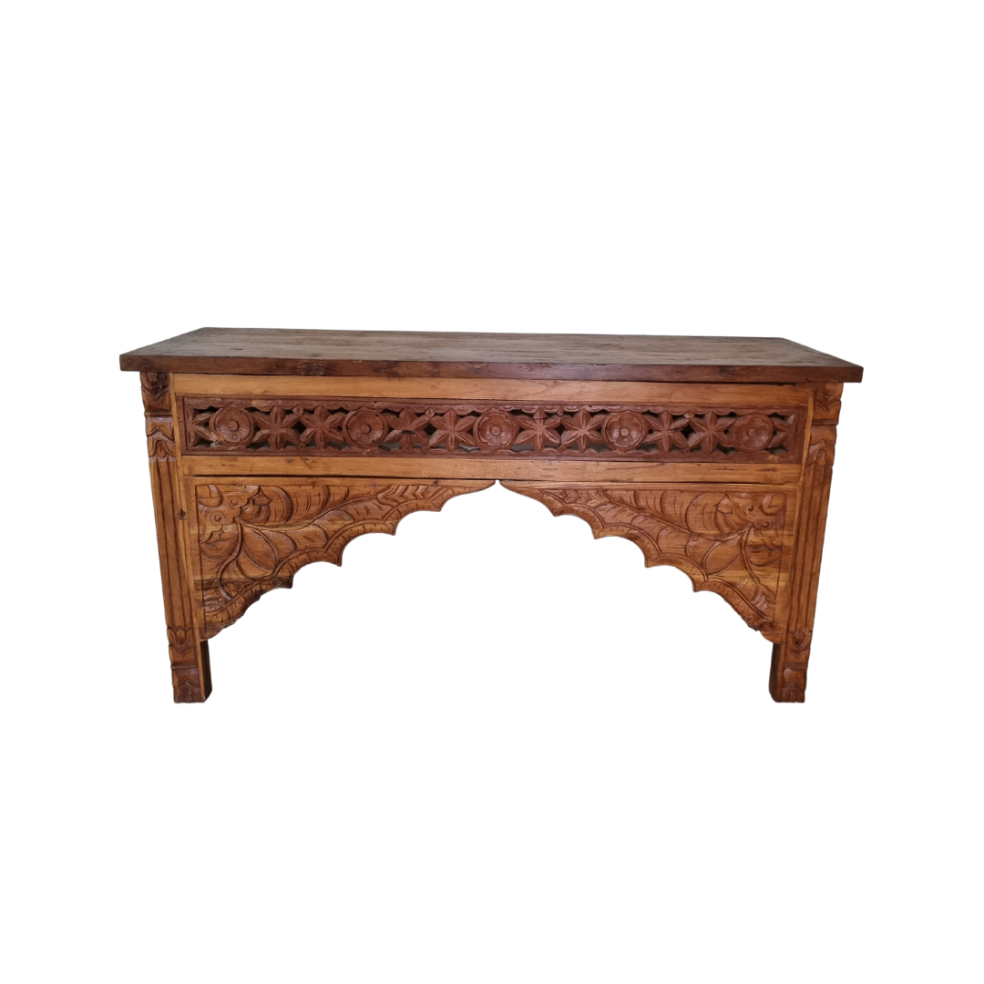 Wooden teak wood console table with dark tones on a white wall background