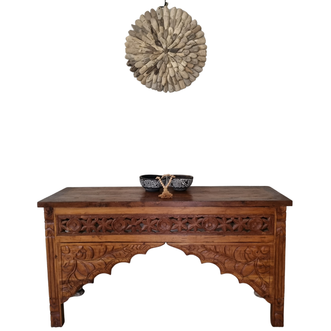 Wooden Console Table Balinese Hand carved design, with 2 wooden bowls, and a drift wood wooden circular wall art on a white wall