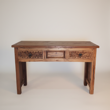 Wooden console table with decorative carvings on a plain background