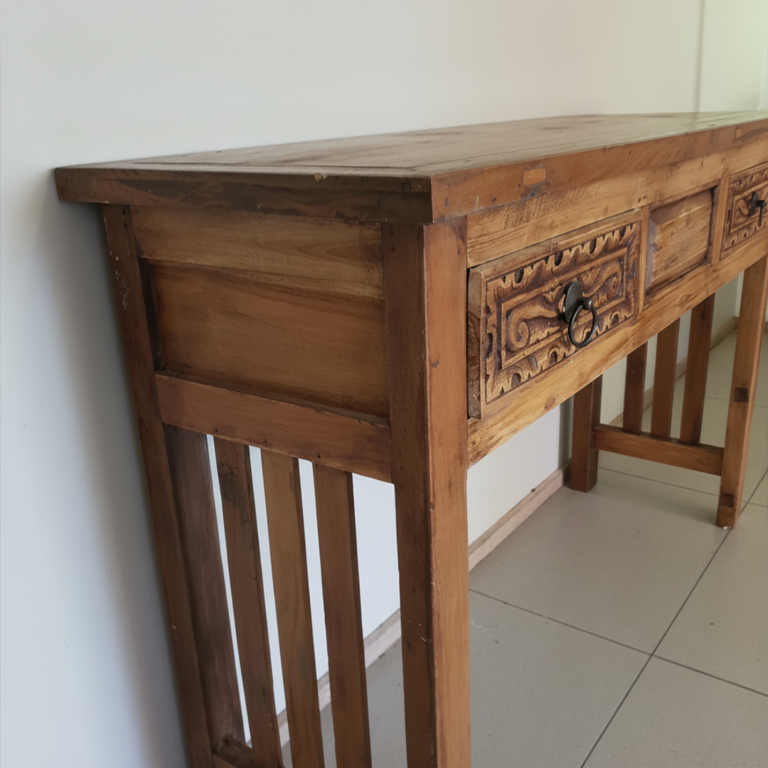 Close up of hand-carved drawer detail and iron ring pull on Balinese reclaimed teak console table