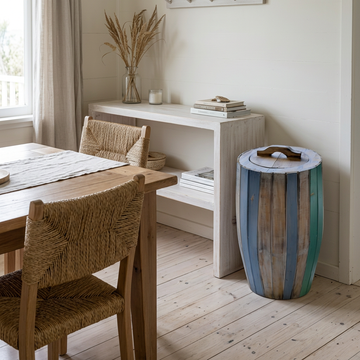 Weathered blue, turquoise and natural timber slats beside a whitewashed console in a coastal dining nook with woven chairs.