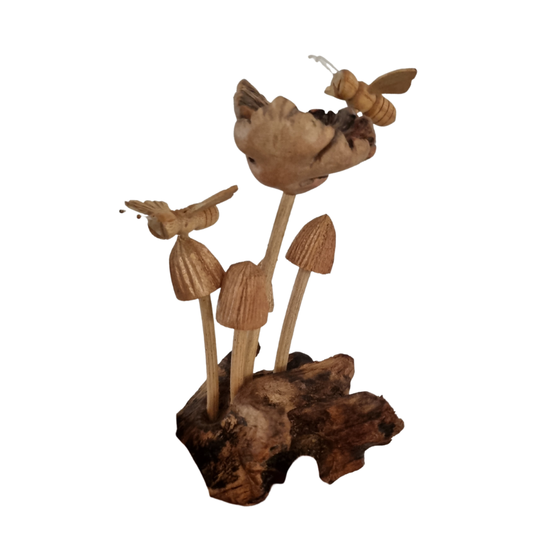 Sculpture of fungi and a bee on a root base, isolated on a white background