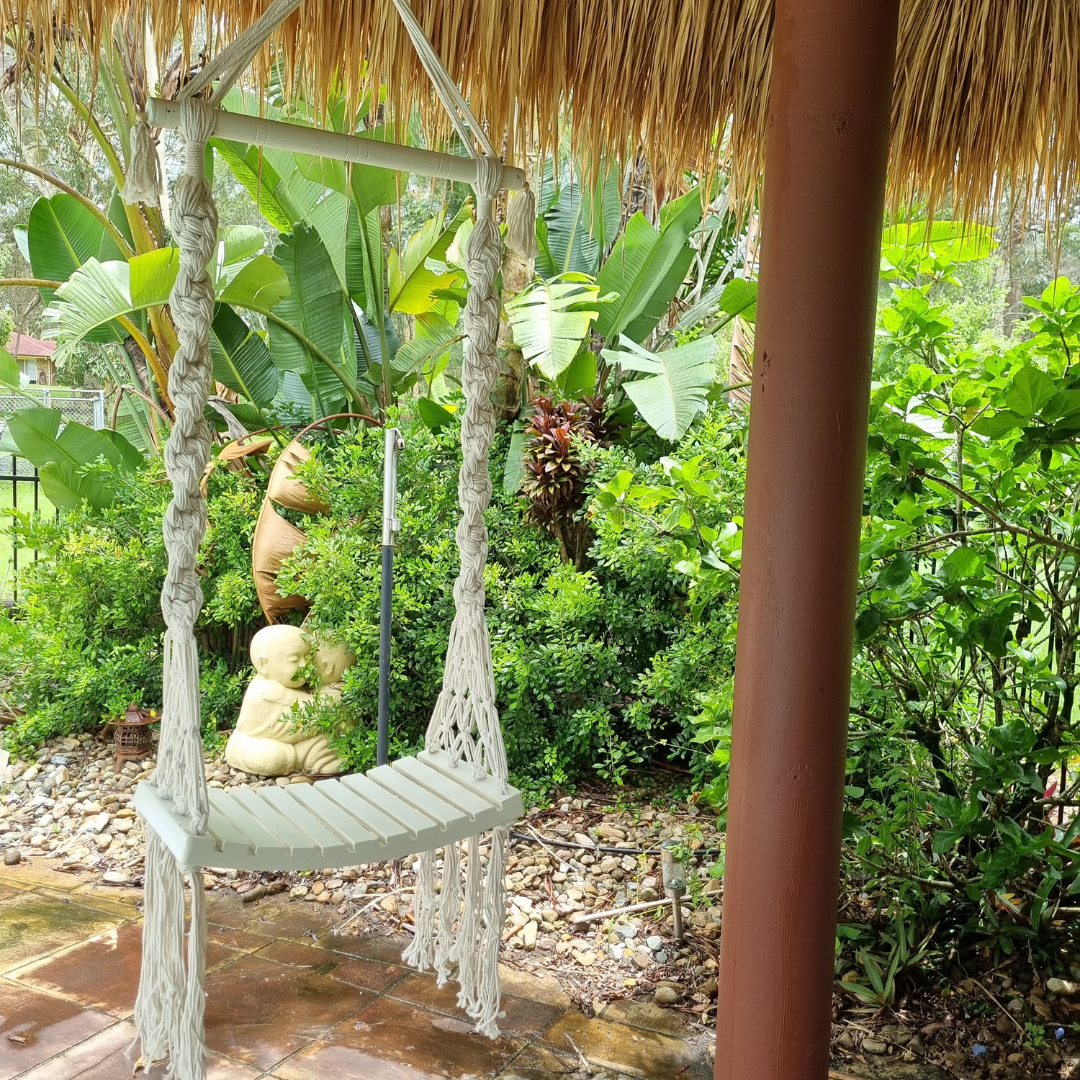 Boho Bliss Macrame Swing in a garden setting
