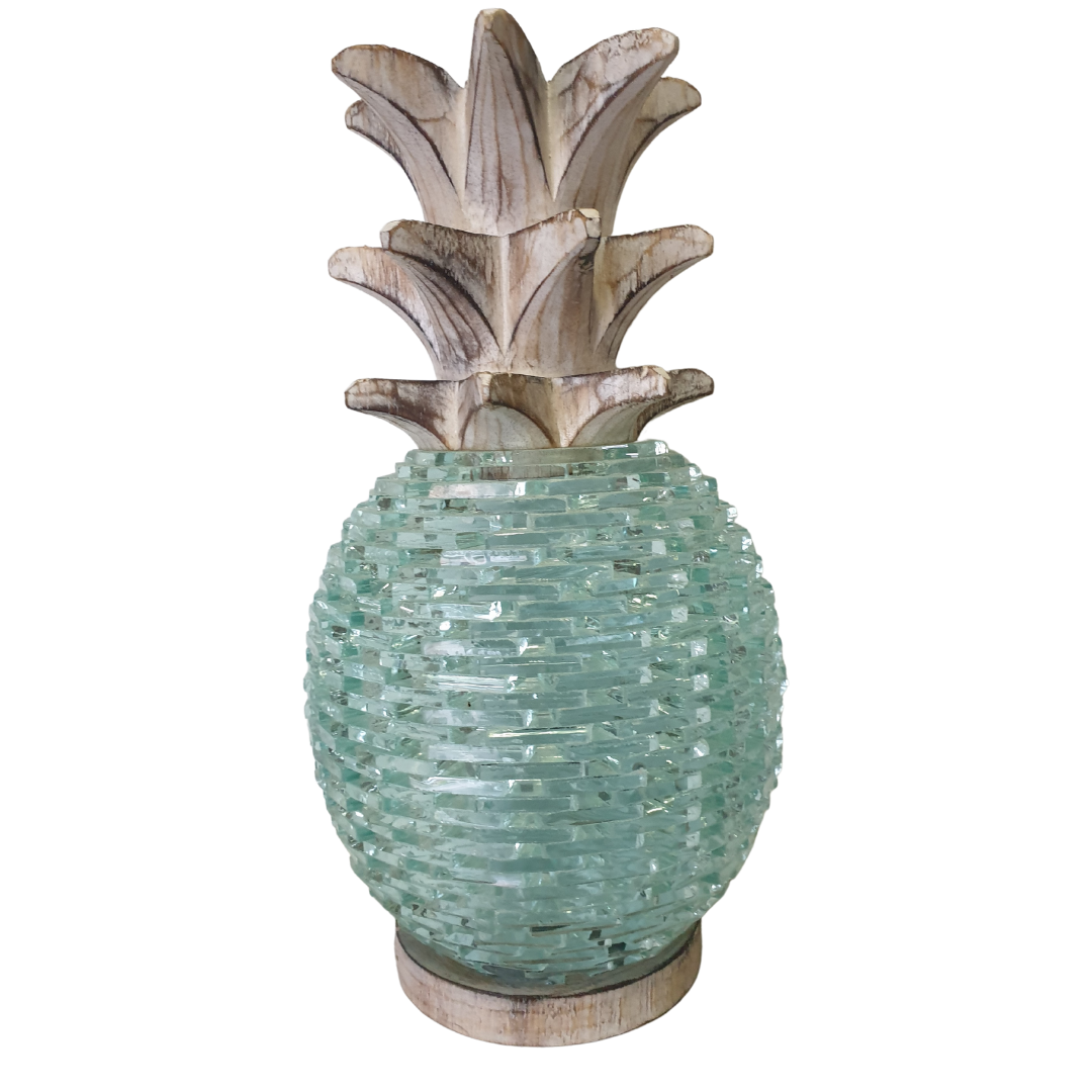 Close-up front view of large Boho Glass Pineapple Décor showing the layered aqua sea-glass mosaic textured body, whitewashed carved wooden leaf top and timber base — handcrafted tropical boho tabletop sculpture by Azure Decor