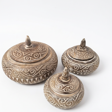 Boho Harmony Wooden Bowl Collection in three sizes with carved patterns and pointed lids on a white background