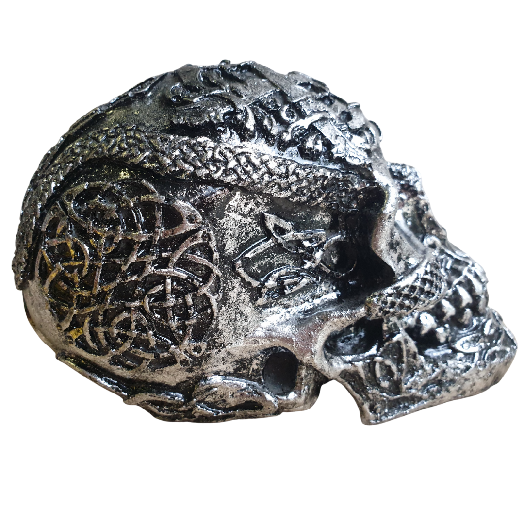 Side profile of Boho Skull Art Tabletop Design in Silver, showcasing detailed Celtic knotwork and raised resin texture across the temple and jaw, handcrafted tabletop décor piece 17cm x 12cm x 11cm by Azure Decor