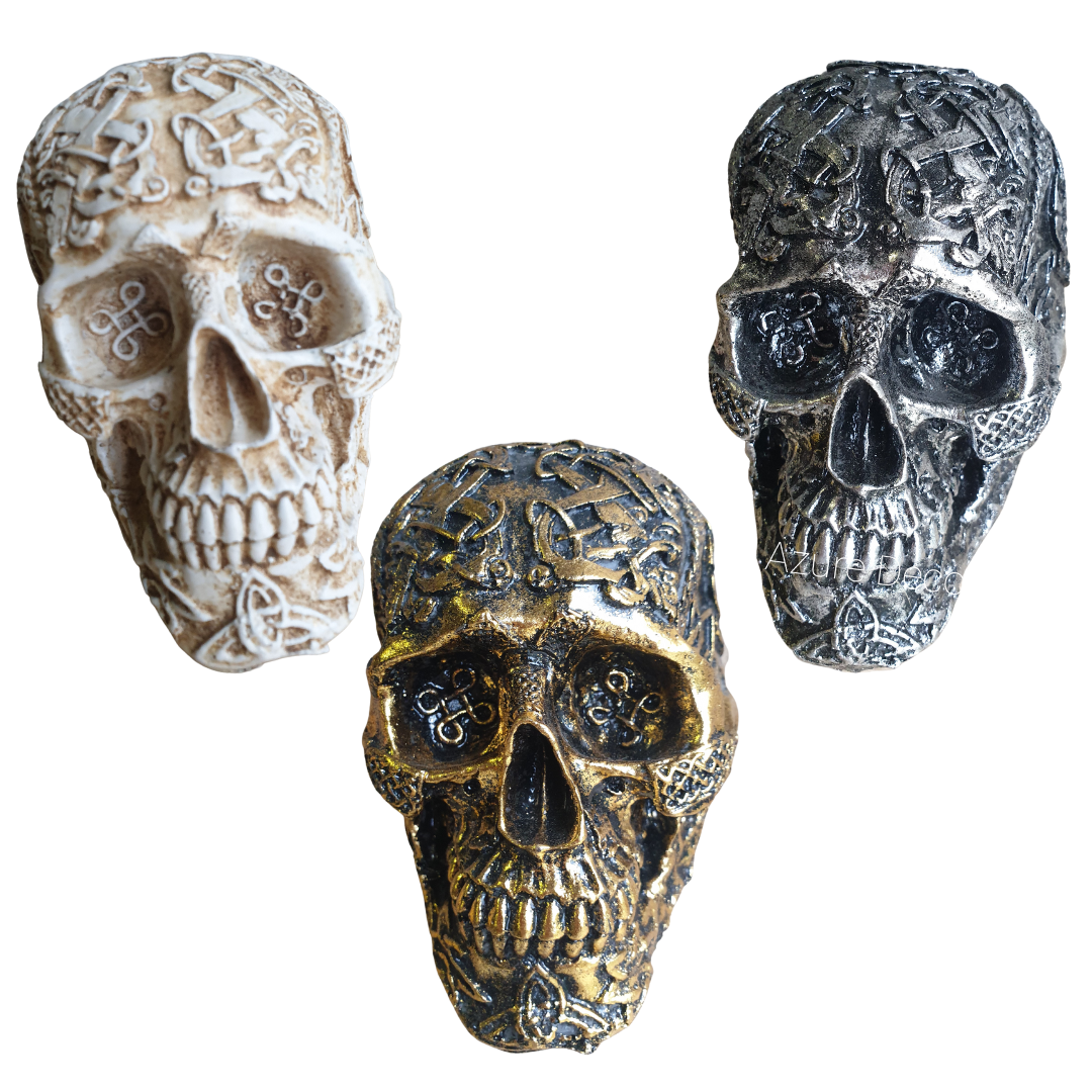Boho Skull Art Tabletop Design shown in all three colours — White/Cream, Gold, and Silver — handcrafted resin human skulls with intricate Celtic knotwork detailing, 17cm x 12cm x 11cm tabletop décor pieces by Azure Decor