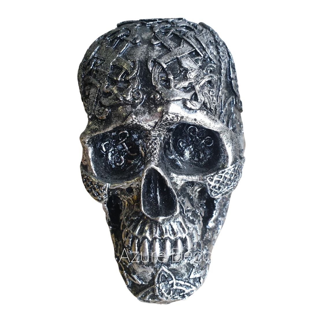Front view of Boho Skull Art Tabletop Design in Silver, showcasing deep-set eye sockets and intricate Celtic knotwork and symbol detailing across the handcrafted resin surface, 17cm x 12cm x 11cm tabletop décor piece by Azure Decor