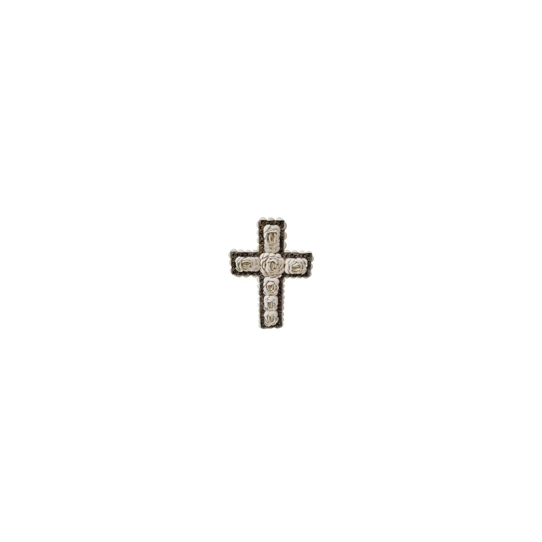 shell cross boho decor on a white wall 