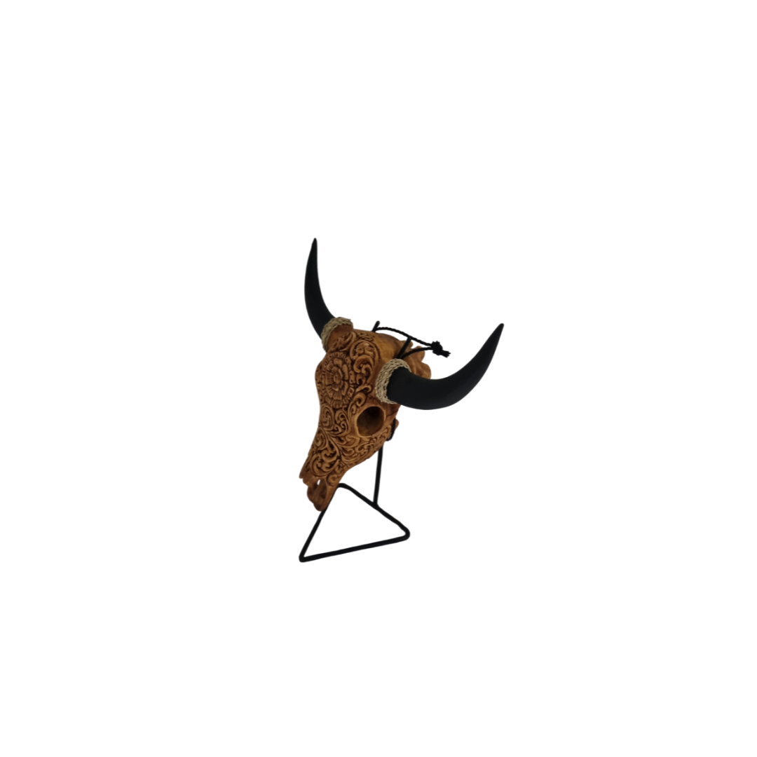 Celestial Flora Skull – hand-painted resin bull skull with intricate warm brown floral scroll pattern on black metal triangle stand, white background
