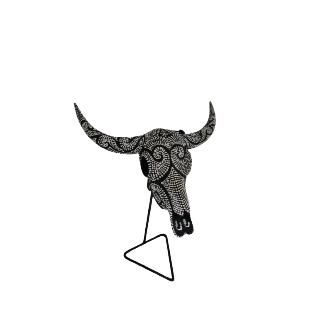 Night Bull Skull – hand-painted resin bull skull with intricate black and white dot mandala pattern covering skull and horns on black metal triangle stand, white background