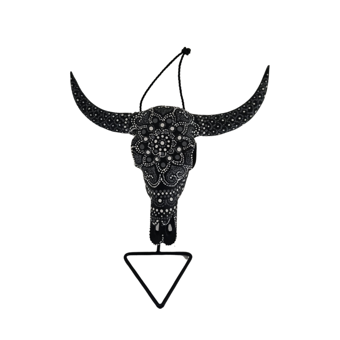 Nocturnal Mandala Skull – hand-painted resin bull skull with intricate black and silver dot mandala pattern covering skull and horns, with black hanging cord on black metal triangle stand, white background
