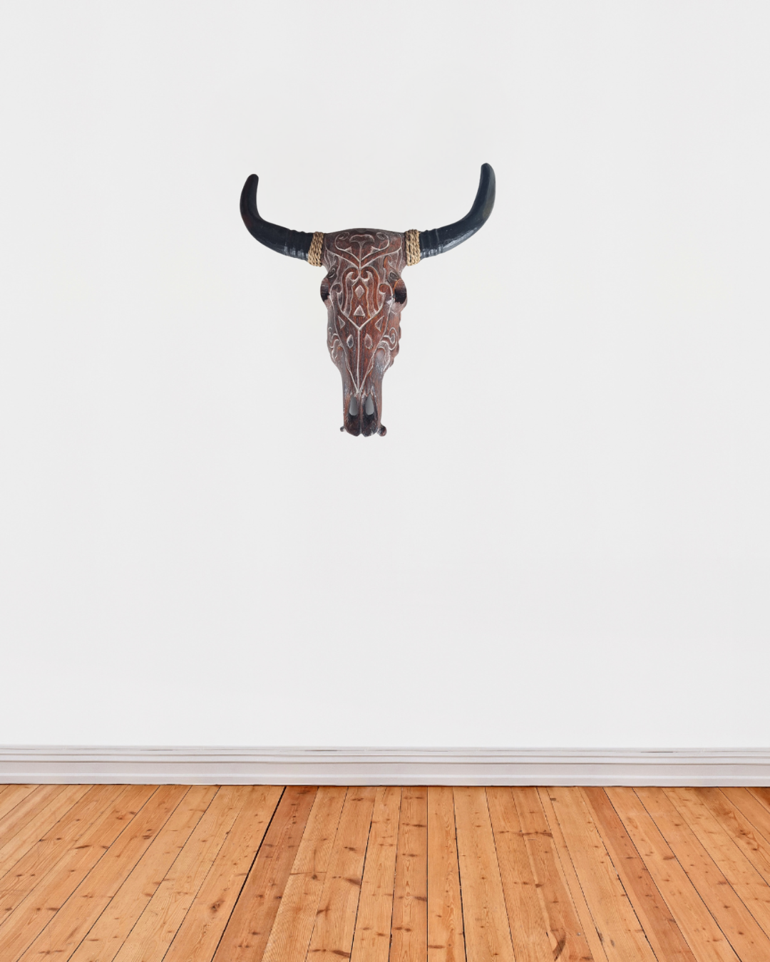 Wooden bull skull wall carving in brown wash finish with hand-carved tribal pattern and dark horns | Azure Decor