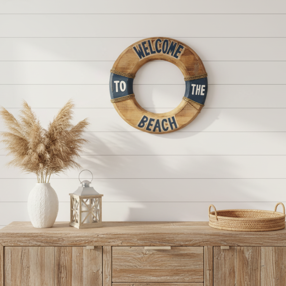 Coastal rustic wall décor buoy ring sign in dark navy and timber hung above a wooden sideboard with pampas grass and a coastal lantern
Turquoise living room lifestyle shot:
