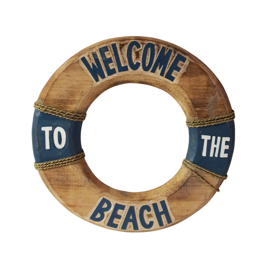 A rustic wooden life preserver wall sign with blue painted sections and rope details, featuring the text 'WELCOME TO THE BEACH' in blue and white lettering.