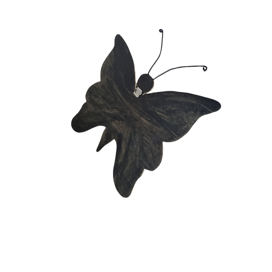Back view of plain black butterfly wall décor with silver hanging hook on white wall.