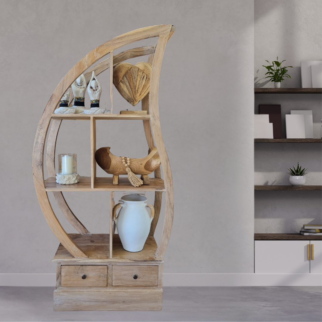 Wooden circular shelf with decorative items against a neutral wall.