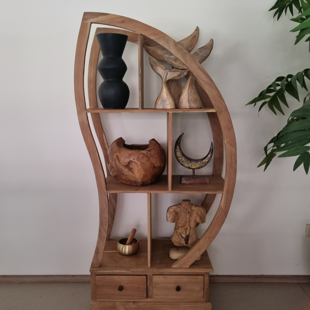 Wooden shelf with decorative items against a white wall
