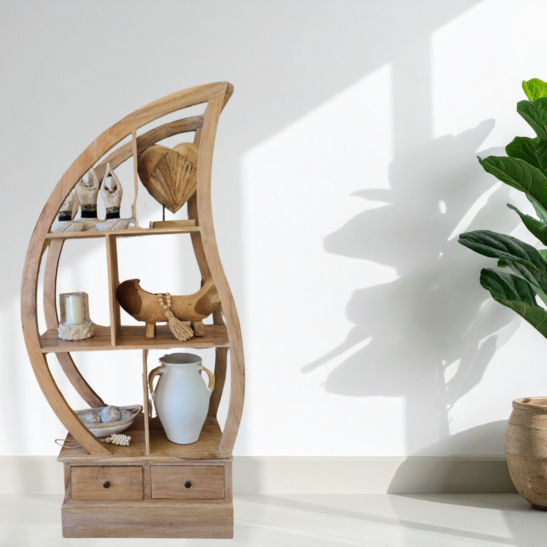 Wooden circular shelf with decorative items against a white wall