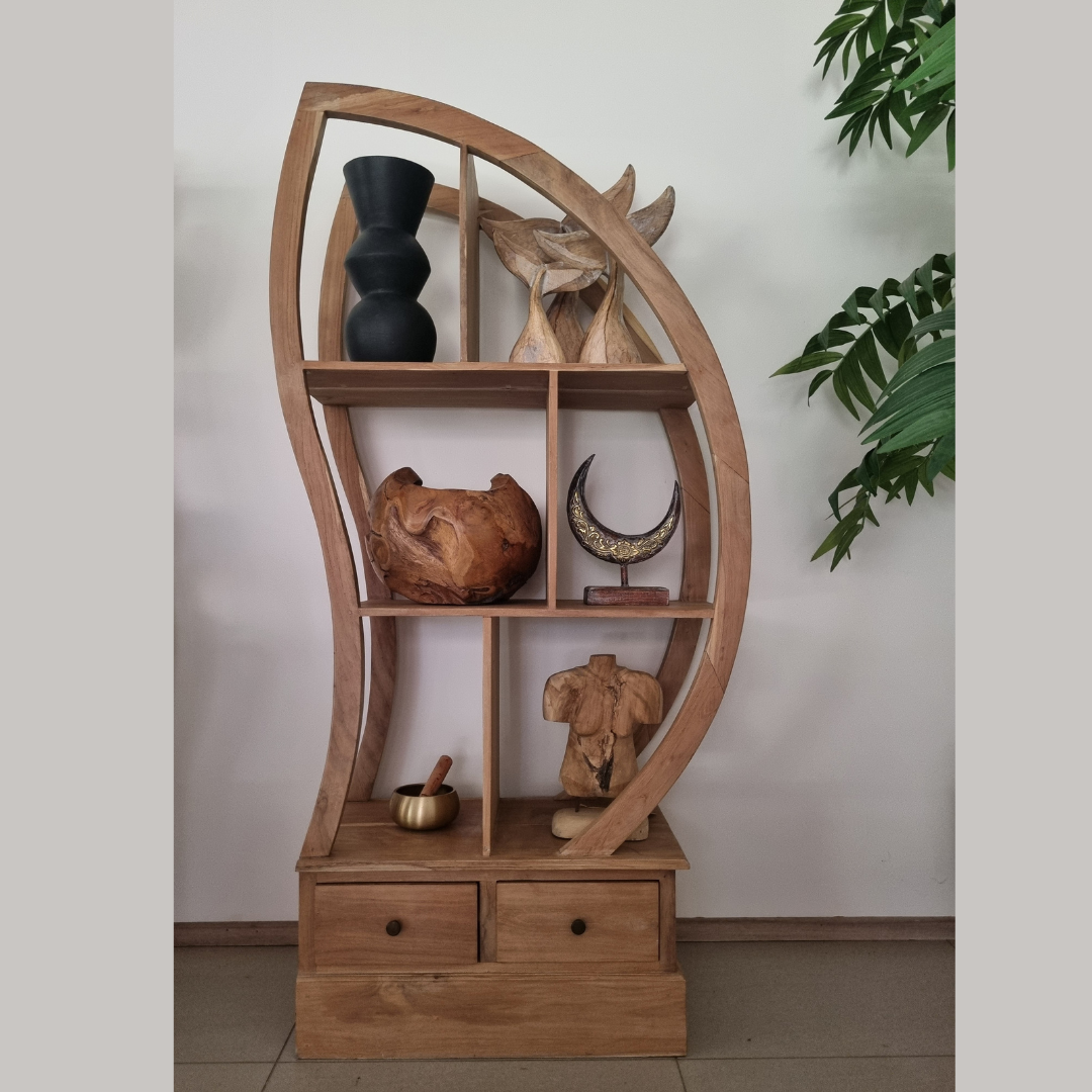 Wooden shelf with decorative items against a plain wall