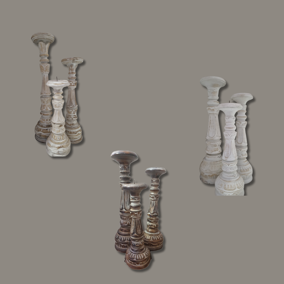 Set of decorative candle holders on a gray background