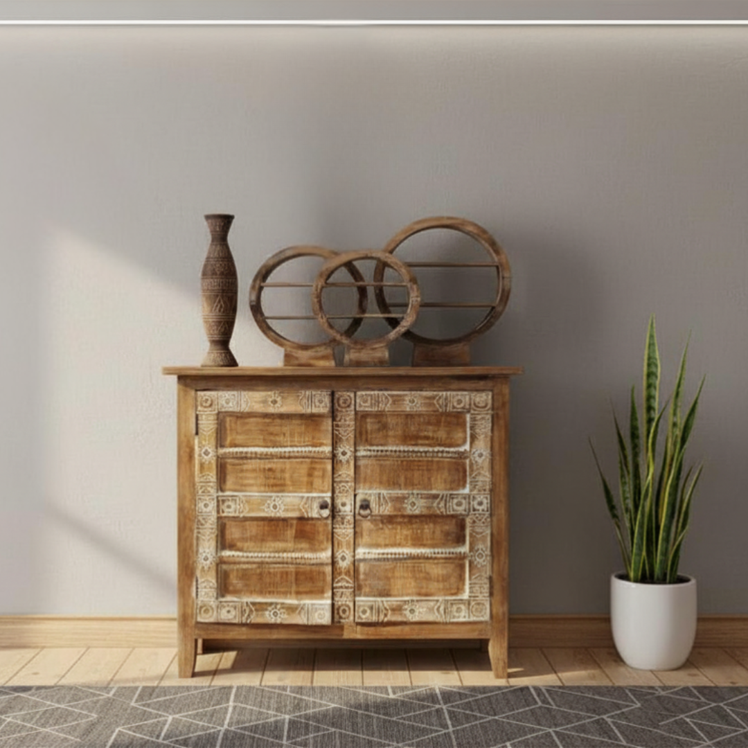 Brown wash circular console table décor set of three styled on a carved timber console table in a coastal Hamptons hallway with rattan mirror and palm plant