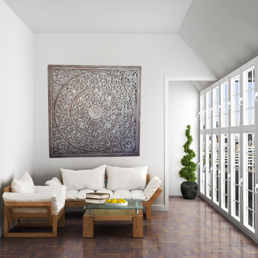 Modern living room with wooden sofa, glass coffee table, and decorative wall art.