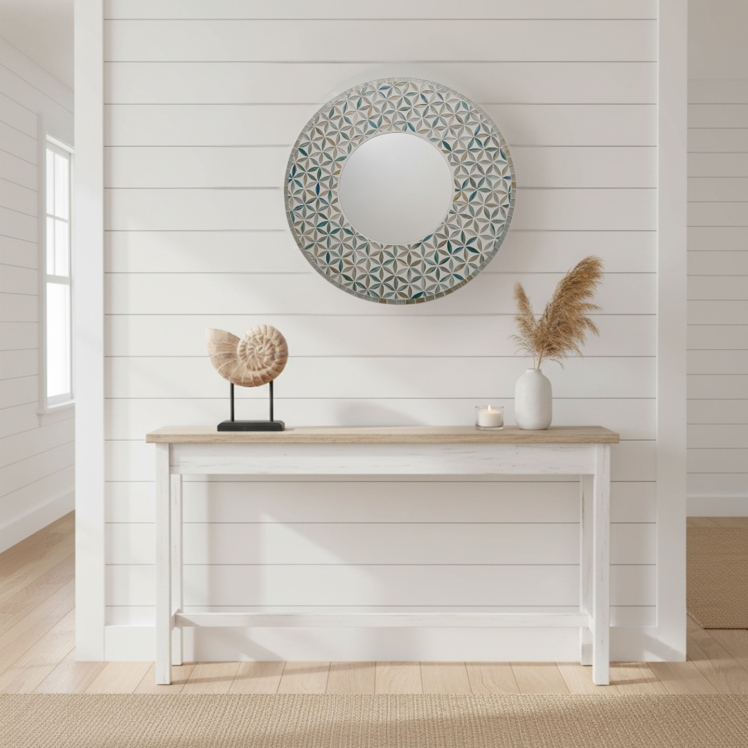Small hand-crafted wooden nautilus shell sculpture on black stand styled on a white Hamptons hallway table with pampas grass and mosiac  mirror – coastal home decor by Azure Decor

