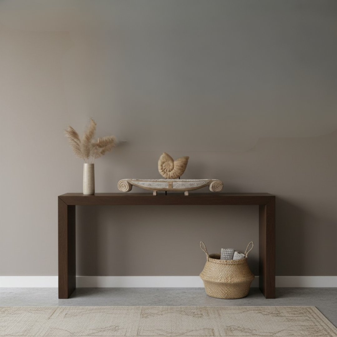 Hand-crafted wooden nautilus shell sculpture on black stand displayed on a Balinese carved timber tray on a dark console table, styled with pampas grass in ceramic vase and woven basket – coastal boho home decor by Azure Decor