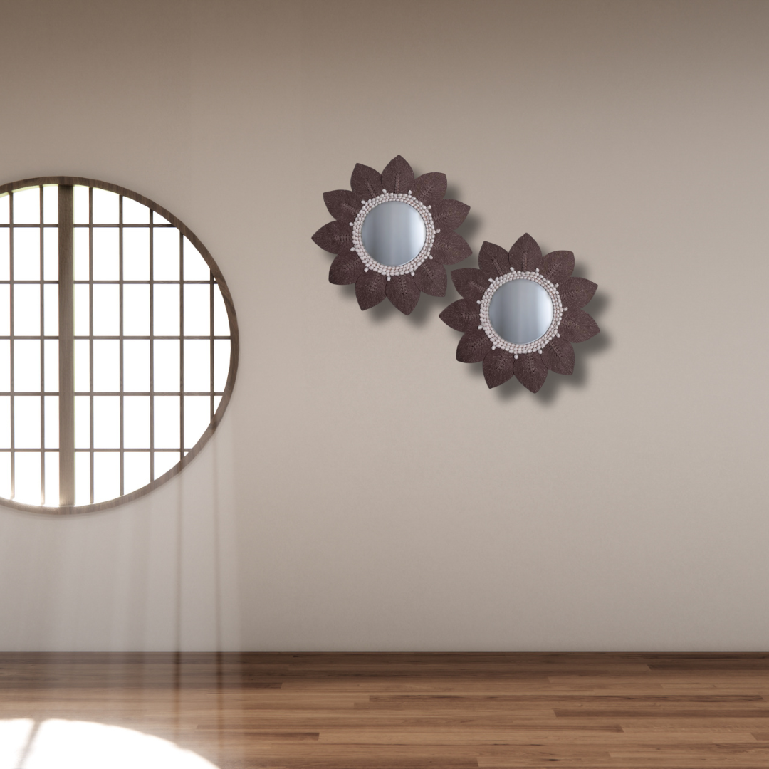Brown macramé leaf wall mirror with white shell bead surround on a beige wall, handcrafted boho coastal décor in Australia.