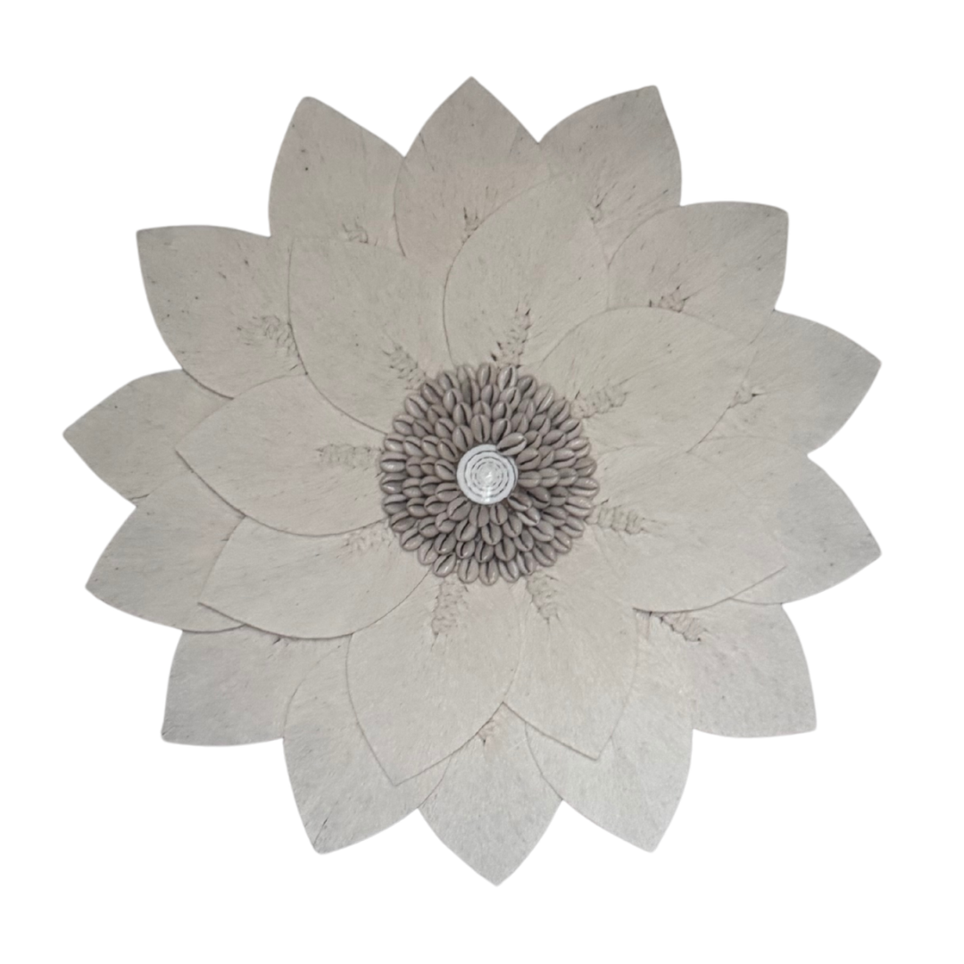 closeup of a macrame Decorative wall art with a flower design on a white background