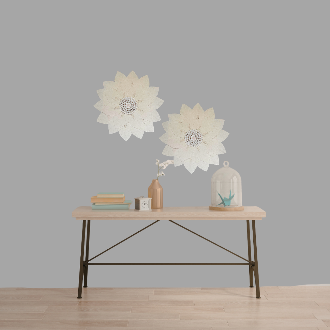 macrame Decorative wall art on a plain wall with a wooden table in the foreground.